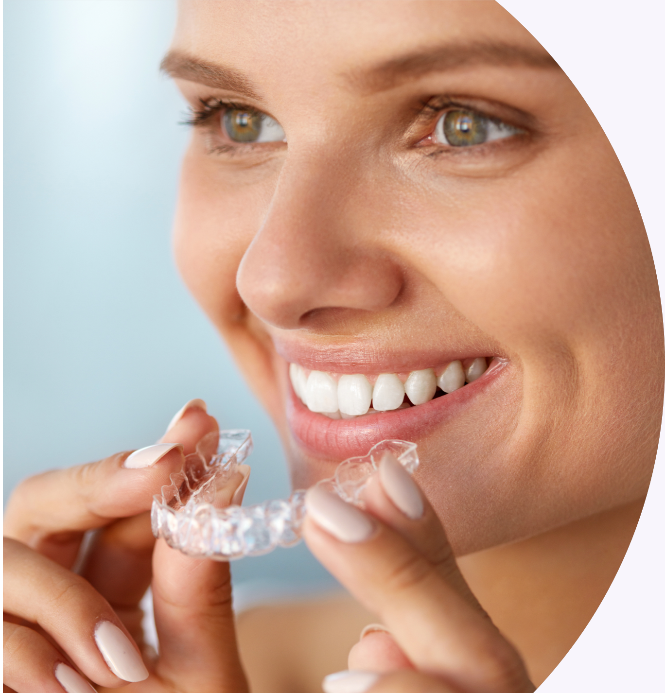 woman putting in Invisalign braces
